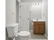 Bright bathroom with a toilet and vanity with a light wood cabinet with drawers and white countertops at 6231 W Clinton St, Stilesville, IN 46180