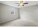 Bedroom with neutral walls, carpet flooring, a ceiling fan, and a window at 6231 W Clinton St, Stilesville, IN 46180