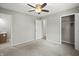 Bedroom featuring carpet, neutral walls, ceiling fan, and access to closet and bathroom at 6231 W Clinton St, Stilesville, IN 46180