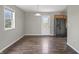 Eat-in kitchenette has stainless steel appliances, wood cabinets, laminate flooring and large picture window at 6231 W Clinton St, Stilesville, IN 46180