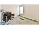 Finished basement space with a bar area, stools, and a putting green for recreation at 6398 Marden Trl, Brownsburg, IN 46112