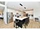 Contemporary kitchen featuring a center island with seating, stainless steel appliances, and ample counter space at 6398 Marden Trl, Brownsburg, IN 46112