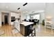 Modern kitchen featuring white cabinets, stainless steel appliances, and a large island with seating at 6398 Marden Trl, Brownsburg, IN 46112
