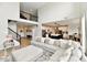 Spacious living room showcasing an open floor plan, high ceilings, and seamless flow to the kitchen at 6398 Marden Trl, Brownsburg, IN 46112
