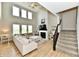 Elegant living room with high ceilings, large windows, fireplace, and stylish furniture at 6398 Marden Trl, Brownsburg, IN 46112