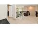 Upstairs loft area with a comfortable chair, glass table, and views of the downstairs living space at 6398 Marden Trl, Brownsburg, IN 46112