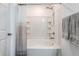 Bright bathroom showcasing a shower and tub combination with curtain and towel rack at 6559 Ambrosia Ln, Pendleton, IN 46064