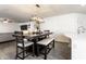 Dining room with a rustic wooden table, pendant lighting, and an open floor plan at 6559 Ambrosia Ln, Pendleton, IN 46064