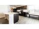 Open kitchen featuring modern appliances, a kitchen island, and lots of counter space at 6559 Ambrosia Ln, Pendleton, IN 46064