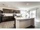 Kitchen with island, stainless steel sink and modern appliances, with access to outside at 6559 Ambrosia Ln, Pendleton, IN 46064