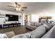 Spacious living room featuring hardwood floors and large television with comfortable seating at 6559 Ambrosia Ln, Pendleton, IN 46064