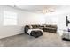 Cozy living room showcasing a comfortable sectional sofa, and ceiling fan at 6559 Ambrosia Ln, Pendleton, IN 46064