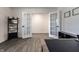 Spacious office features french doors and gray wood flooring at 6559 Ambrosia Ln, Pendleton, IN 46064