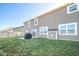 A spacious backyard features a lawn, fence, and a patio with a grill at 657 Kilmore Dr, Pendleton, IN 46064