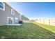 Large, fenced backyard with a patio and well-maintained lawn at 657 Kilmore Dr, Pendleton, IN 46064