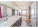 Bathroom featuring double sinks, large mirror, shower, and tub at 657 Kilmore Dr, Pendleton, IN 46064