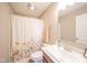 Bathroom featuring a shower and sink with floral curtain at 657 Kilmore Dr, Pendleton, IN 46064