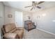 Charming Bedroom featuring a comfortable chair, crib, and neutral decor at 657 Kilmore Dr, Pendleton, IN 46064