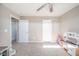 Spacious bedroom with neutral carpet and multiple doors leading to other rooms at 657 Kilmore Dr, Pendleton, IN 46064