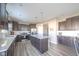 Spacious kitchen featuring dark cabinets, stainless steel appliances, and a large island at 657 Kilmore Dr, Pendleton, IN 46064
