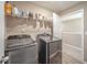 Laundry room featuring two modern washing machines, wire shelving at 657 Kilmore Dr, Pendleton, IN 46064