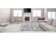 Bright living room featuring a fireplace, hardwood floors, and a comfortable seating area at 657 Kilmore Dr, Pendleton, IN 46064