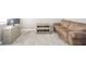 Cozy living area with a plush couch, TV, and carpeted floors, perfect for relaxation at 657 Kilmore Dr, Pendleton, IN 46064
