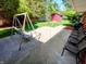 Relaxing back patio with a swing and seating area, perfect for enjoying the outdoors at 7017 Mc Lain Dr, Indianapolis, IN 46217