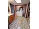 Bright bathroom with patterned floor tiles, a vanity with sink, and a washer/dryer at 7017 Mc Lain Dr, Indianapolis, IN 46217