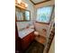 Well-lit bathroom features a modern vanity and shower-tub combo at 7017 Mc Lain Dr, Indianapolis, IN 46217