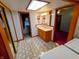 Bright bathroom with patterned floor tiles, a vanity with sink, and lots of storage at 7017 Mc Lain Dr, Indianapolis, IN 46217