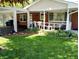 Covered porch with seating and view of a landscaped front yard at 7017 Mc Lain Dr, Indianapolis, IN 46217