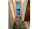 Long hallway features neutral walls and soft carpet leading to living spaces at 7017 Mc Lain Dr, Indianapolis, IN 46217