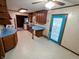 Retro kitchen design with wood cabinets, blue countertops, and light vinyl floor at 7017 Mc Lain Dr, Indianapolis, IN 46217