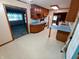 Cozy kitchen with wood cabinets, blue countertops, and bright flooring at 7017 Mc Lain Dr, Indianapolis, IN 46217