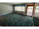 Bright living room features large windows and plush carpeting at 7017 Mc Lain Dr, Indianapolis, IN 46217