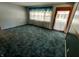 Bright living room features large windows and plush carpeting at 7017 Mc Lain Dr, Indianapolis, IN 46217