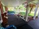 Inviting covered porch with swing, seating, and charming curb appeal at 7017 Mc Lain Dr, Indianapolis, IN 46217