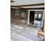 Sunroom with sliding glass door, brick wall, and a display cabinet for added charm at 7017 Mc Lain Dr, Indianapolis, IN 46217