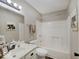 Cozy bathroom with a single vanity, neutral colors, and a shower-tub combo at 710 Marie Ln, Fortville, IN 46040