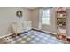 Charming Bedroom featuring a crib, shelving, and a stylish black and white rug at 710 Marie Ln, Fortville, IN 46040