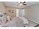 A comfortable bedroom with a decorative rug, stylish furnishings, and a ceiling fan at 710 Marie Ln, Fortville, IN 46040
