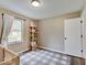 Bedroom with shelving for décor and toys, and a large window with natural light at 710 Marie Ln, Fortville, IN 46040