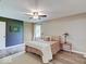 This bedroom features natural light from a window, decor and modern ceiling fan at 710 Marie Ln, Fortville, IN 46040