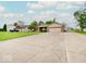 Spacious ranch home with a long driveway, two-car garage, and brick and siding facade at 710 Marie Ln, Fortville, IN 46040