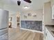 Kitchen view showcasing wood flooring, stainless steel refrigerator and decor details at 710 Marie Ln, Fortville, IN 46040