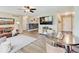 Comfortable living room with brick accent wall, stylish decor, and wood-look flooring at 710 Marie Ln, Fortville, IN 46040