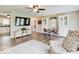 Open-concept living space with wood-look floors, stylish decor, and a modern aesthetic at 710 Marie Ln, Fortville, IN 46040