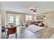 Bright and airy living room with wood-look floors, and cozy seating area at 710 Marie Ln, Fortville, IN 46040