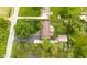 Aerial view of home, highlighting the extensive yard, outbuilding, and convenient neighborhood location at 7135 Lantern Rd, Indianapolis, IN 46256